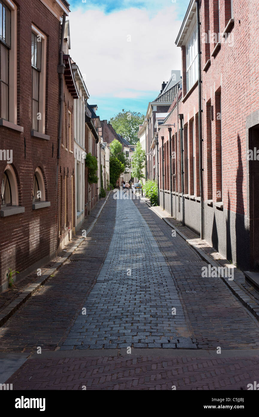 Narrow alley with houses on both sides in Zutphen, Netherlands Stock