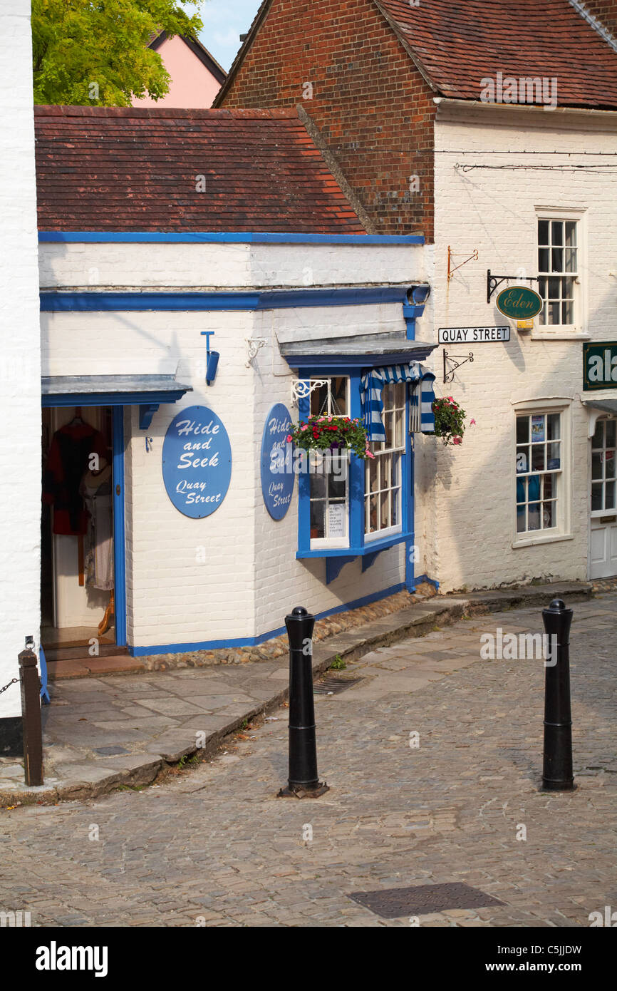 Cobbled Quay Street shops in Lymington, Hampshire UK in June Stock Photo