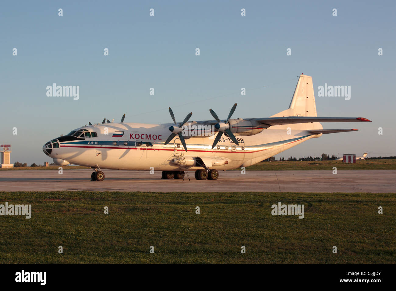 Kosmos Airlines Antonov An-12 four-engine turboprop cargo airplane parked on the ground Stock Photo