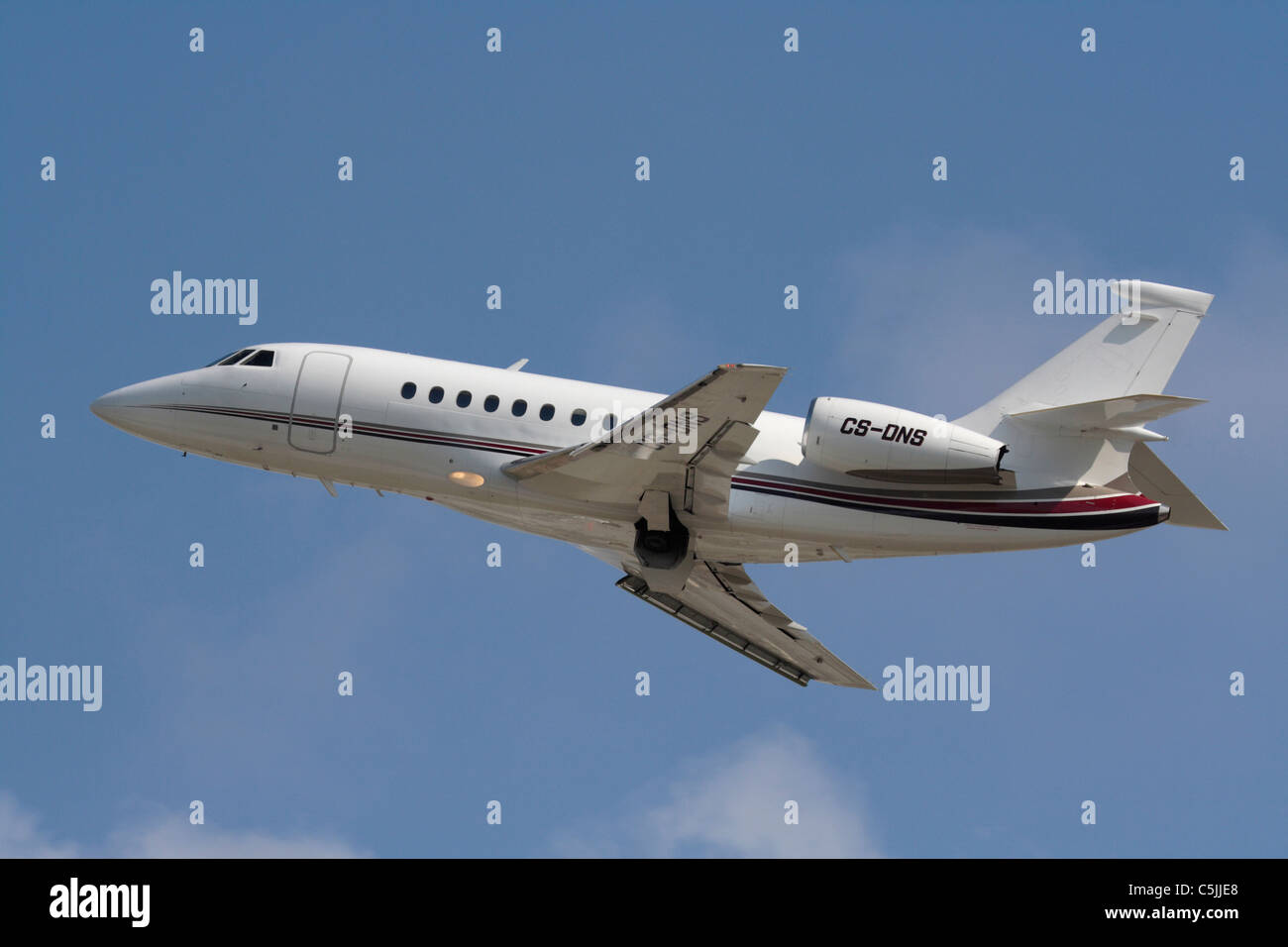 Dassault Falcon 2000 business jet operated by Netjets Europe shown on departure Stock Photo