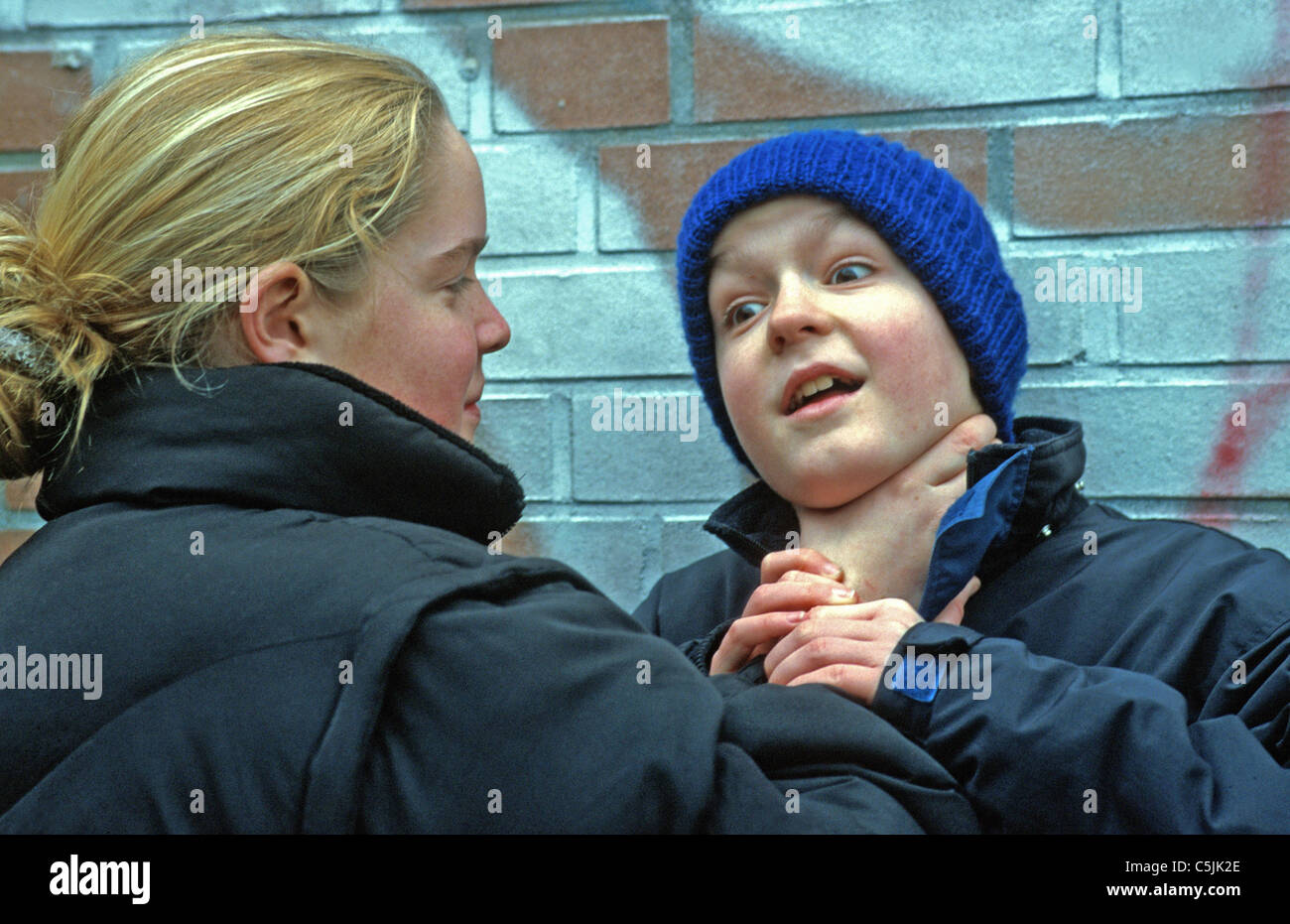 Woman makes a choke hold in self-defense training Stock Photo - Alamy