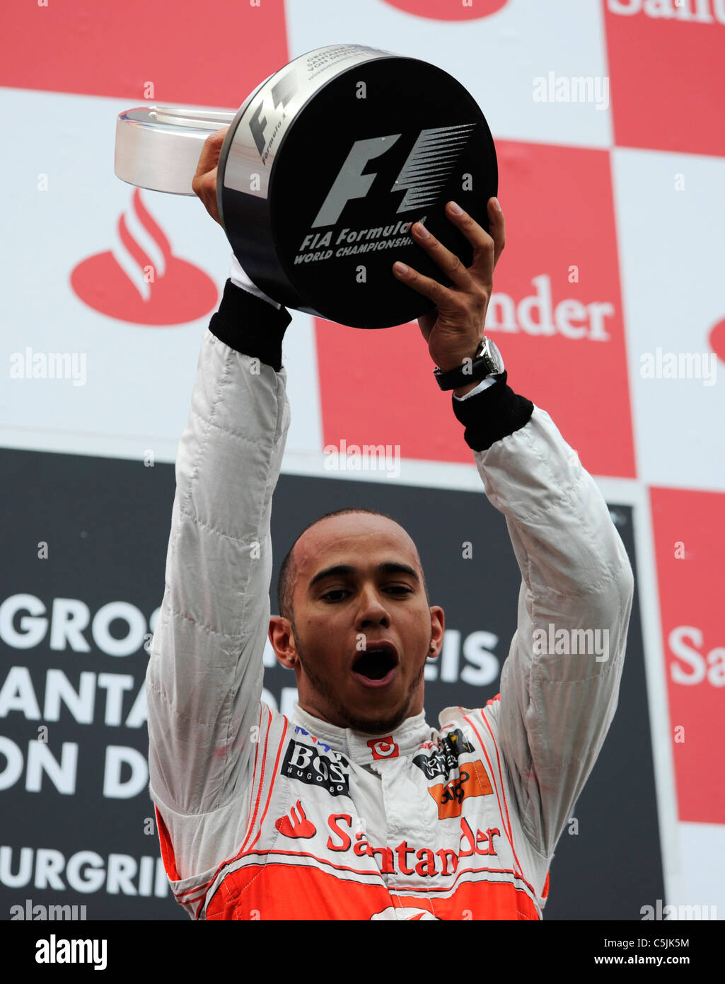 Nuerburgring, Germany July 24 2011, Lewis Hamilton, McLaren, with the winner's trophy at the German Formula One Grand Prix Stock Photo