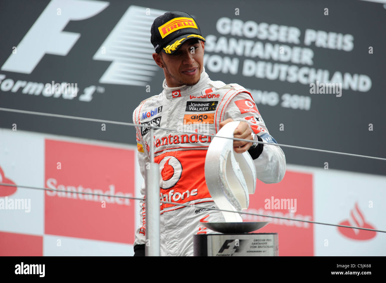 Nuerburgring, Germany July 24 2011, Lewis Hamilton, McLaren, with the winner's trophy at the German Formula One Grand Prix Stock Photo