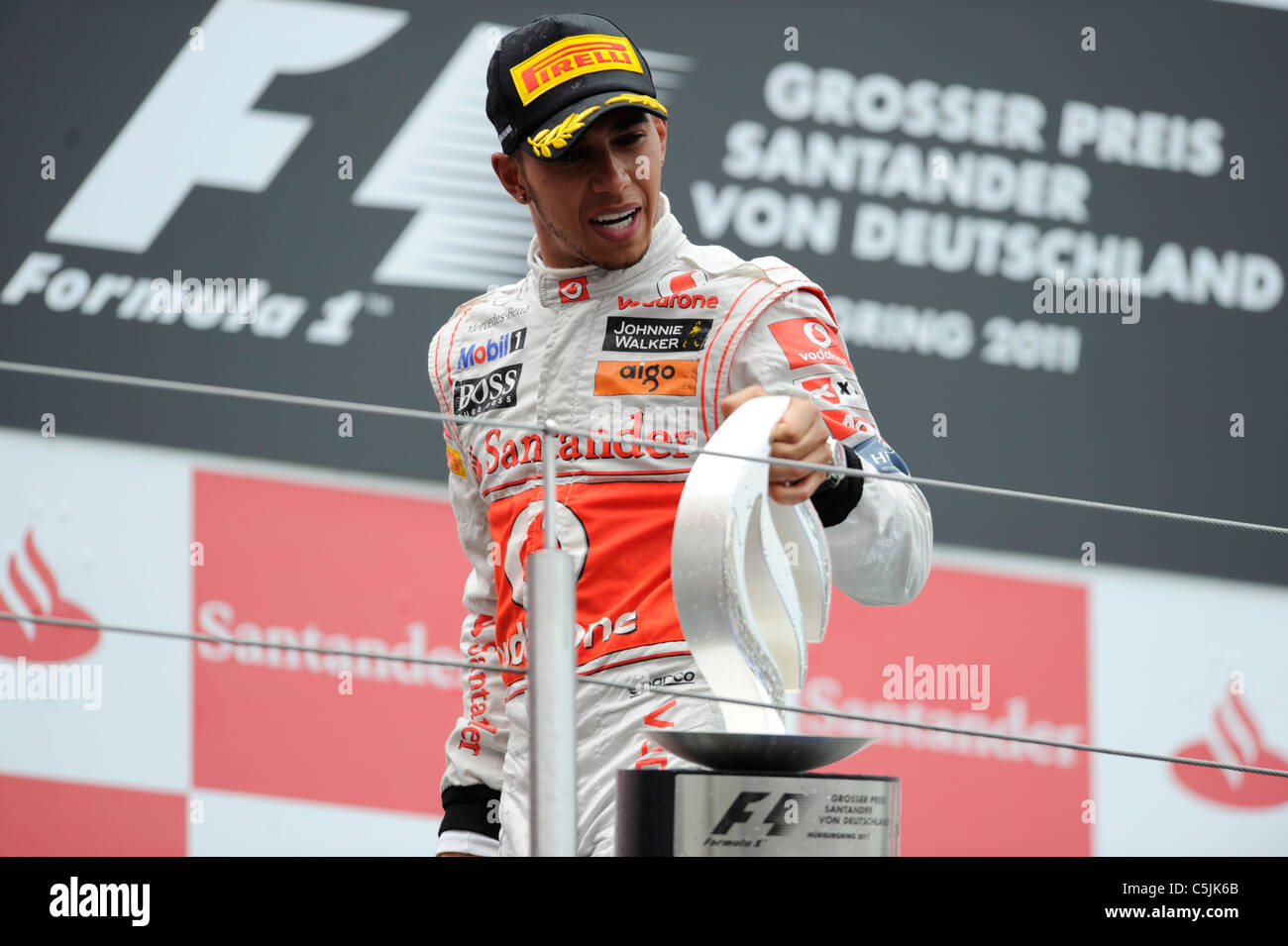 Nuerburgring, Germany July 24 2011, Lewis Hamilton, McLaren, with the winner's trophy at the German Formula One Grand Prix Stock Photo