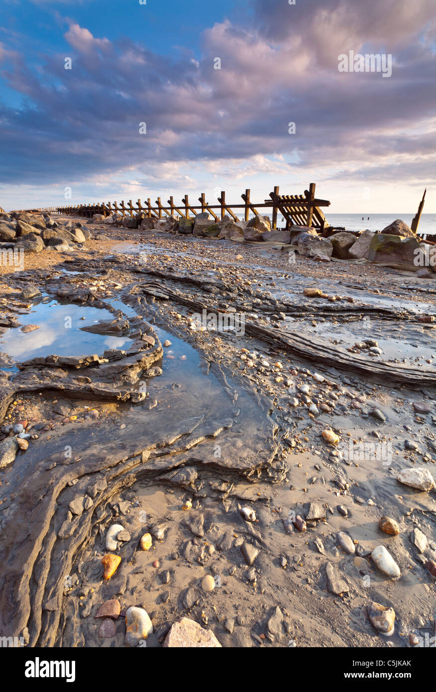 First light illuminated the derelict sea defences at Happisburgh on the