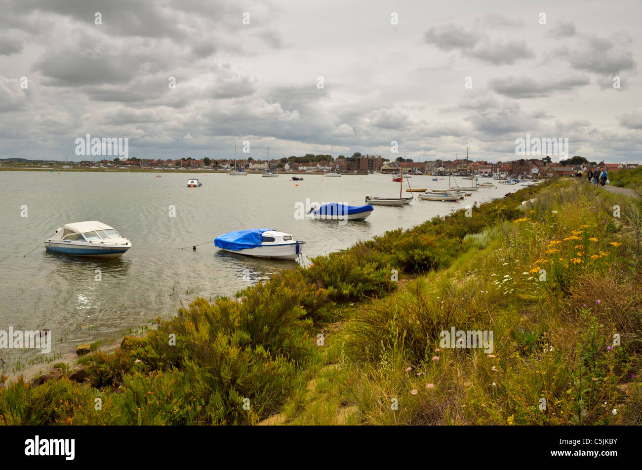 Wells next the Sea Harbour and Town with Boats and Sea Wall Stock Photo