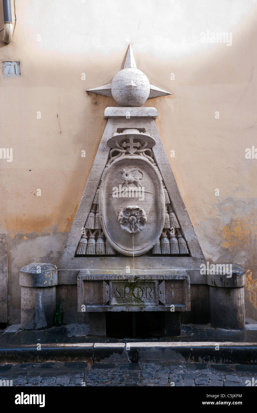 Ornate drinking fountain in Rome. Stock Photo