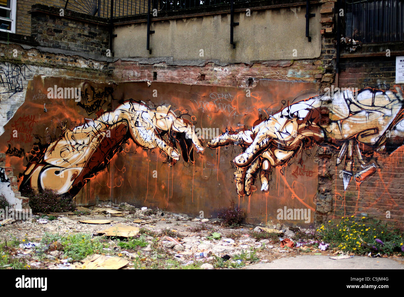 Reworking of Michelangelo's The Creation of Adam, near Brick Lane in London Stock Photo