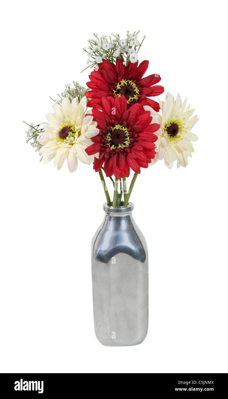 Silk flowers in a retro style silver milk bottle used for delivering milk - path included Stock Photo