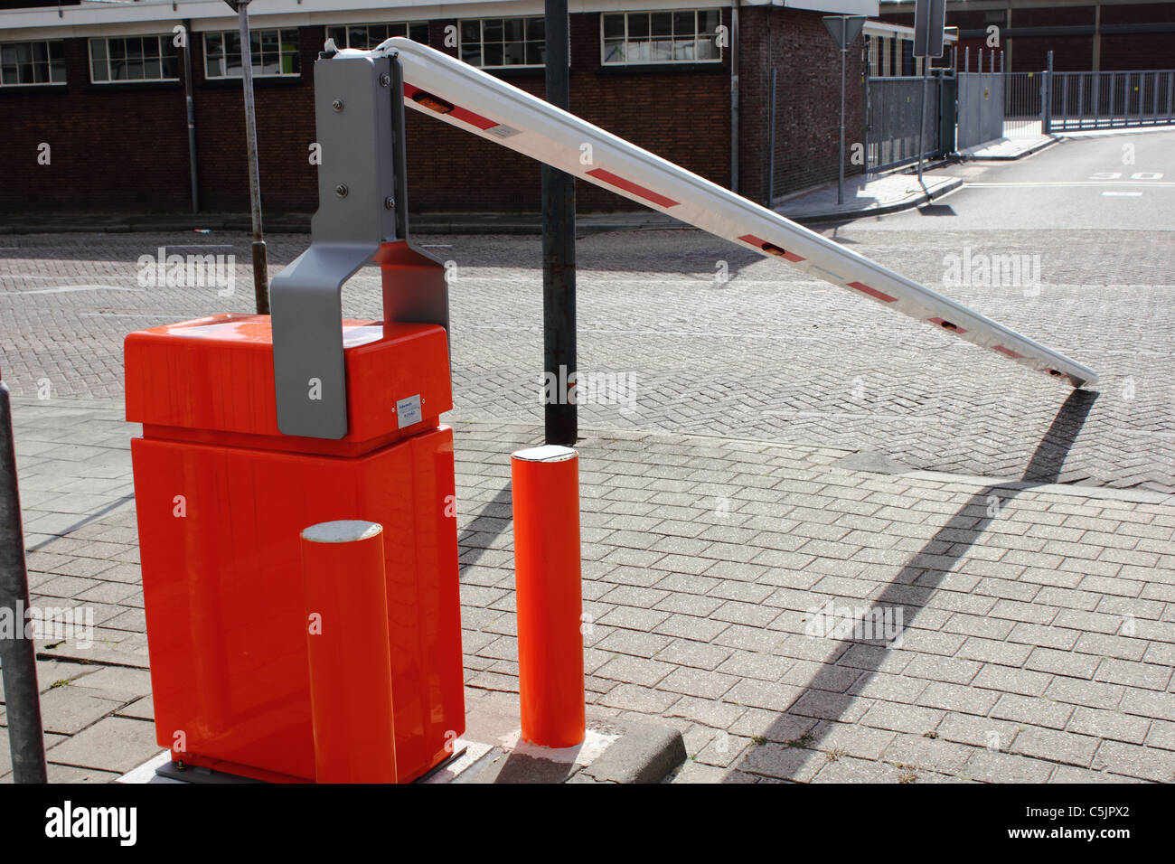 damaged broken down white and red road barrier , conceptual image , metaphor , concept Stock