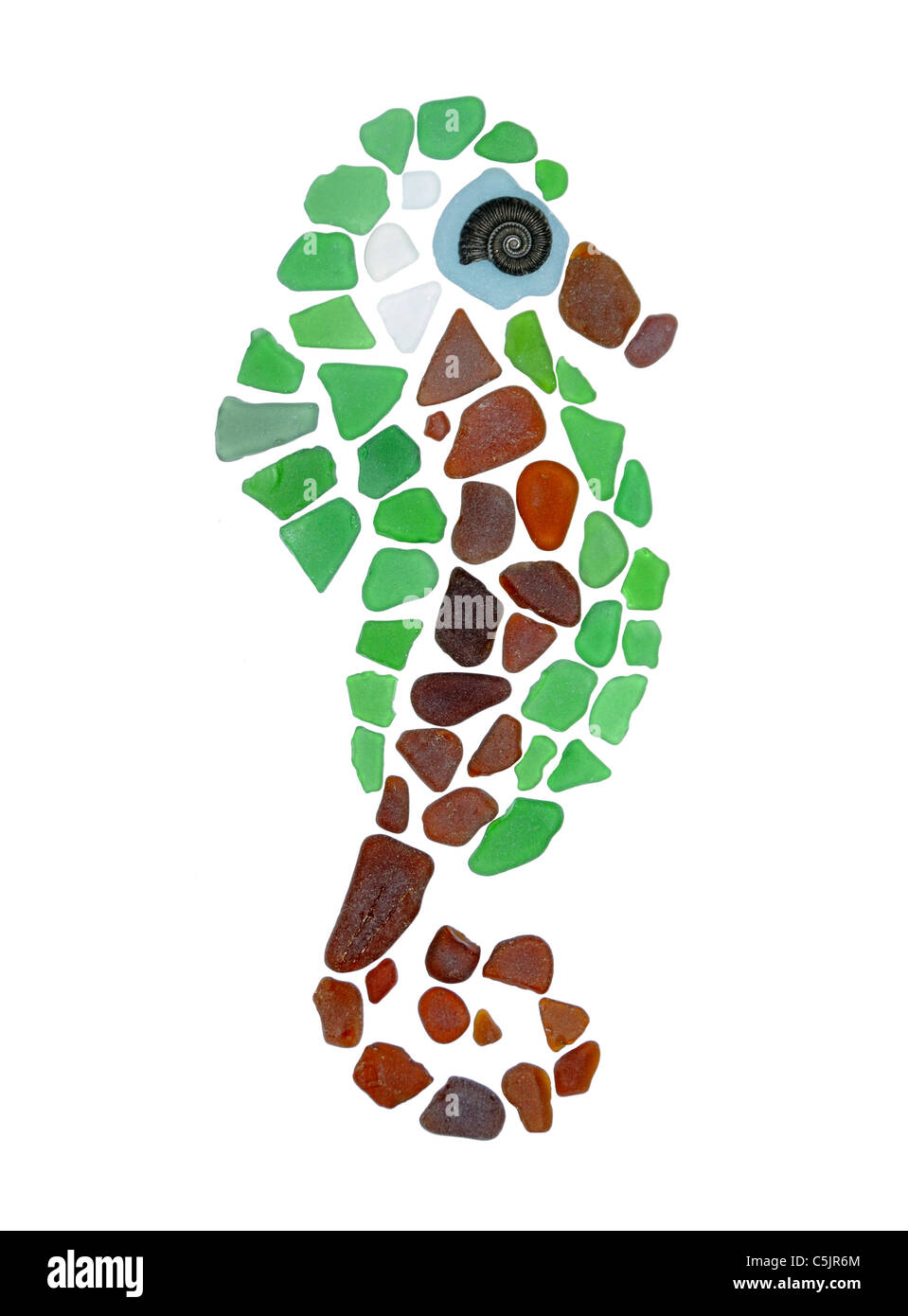 A mosaic of a seahorse made from seaglass - glass collected from the beach - and an ammonite fossil. Isolated on pure white. Stock Photo