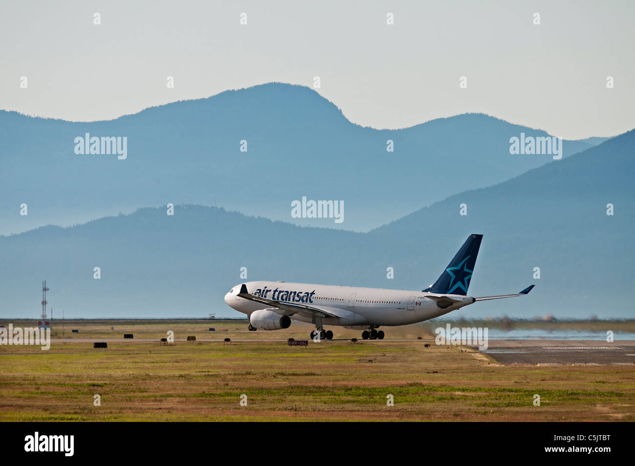 An Air Transat Airbus A330-200 jetliner takes off from Vancouver International Airport. Stock Photo