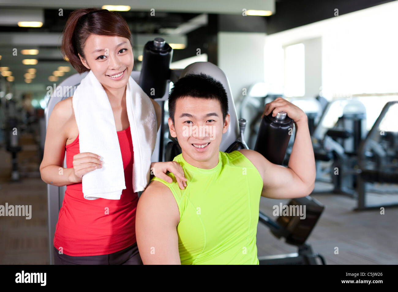 Young Man and Woman Together At Gym Stock Photo - Alamy