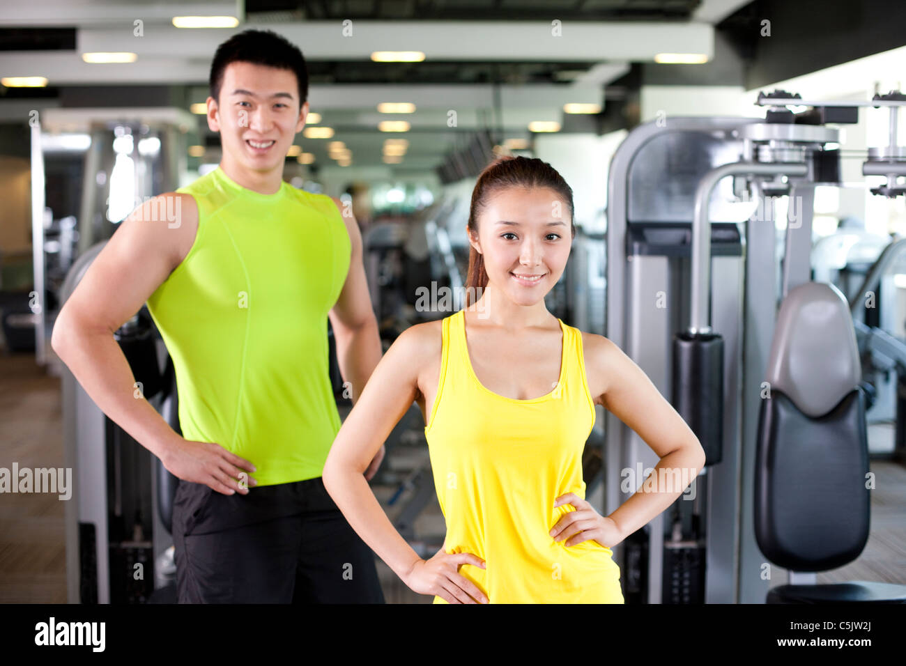 Young Man and Woman Together At Gym Stock Photo - Alamy