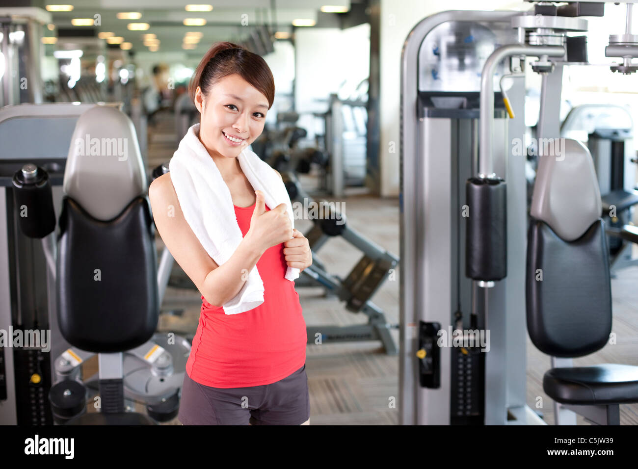 Young woman happy at gym hi-res stock photography and images - Alamy