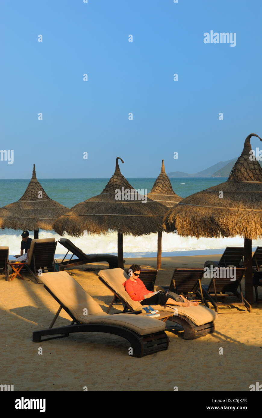 Asia, Vietnam, Nha Trang. Sun shade at the "Sailing Club" beach bar at