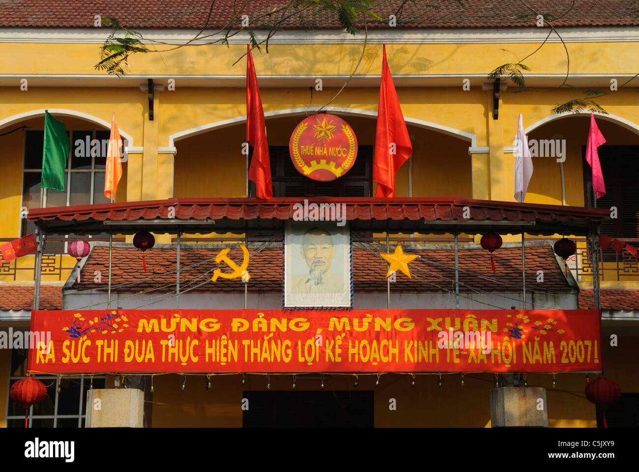 Asia, Vietnam, Hoi An. Hoi An old quarter. Ho Chi Minh is often displayed on posters. The historic buildings, attractive tube Stock Photo