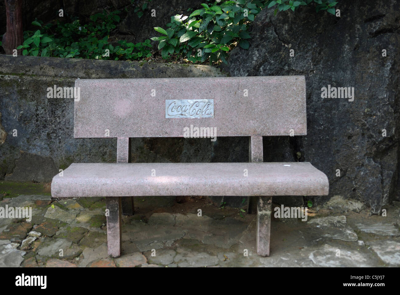 Asia, Vietnam, near Da Nang. Coca Cola park bench within the famous buddhist sanctuaries at the Ngu Hanh Son or Marble Stock Photo