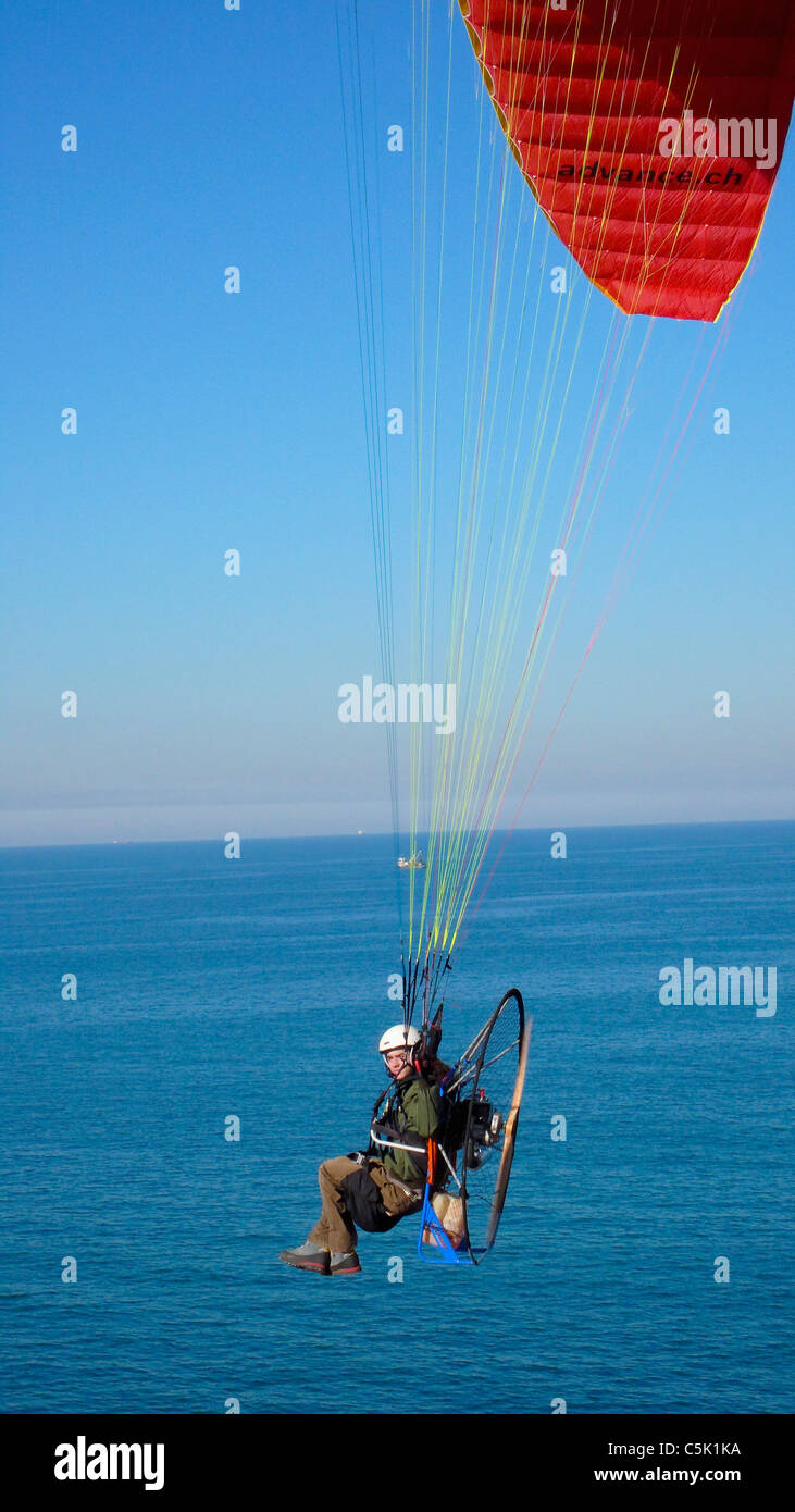 Powered paraglider pilot flying over Kilyos on the Black Sea coast of Istanbul, aerial, view, Turkey Stock Photo