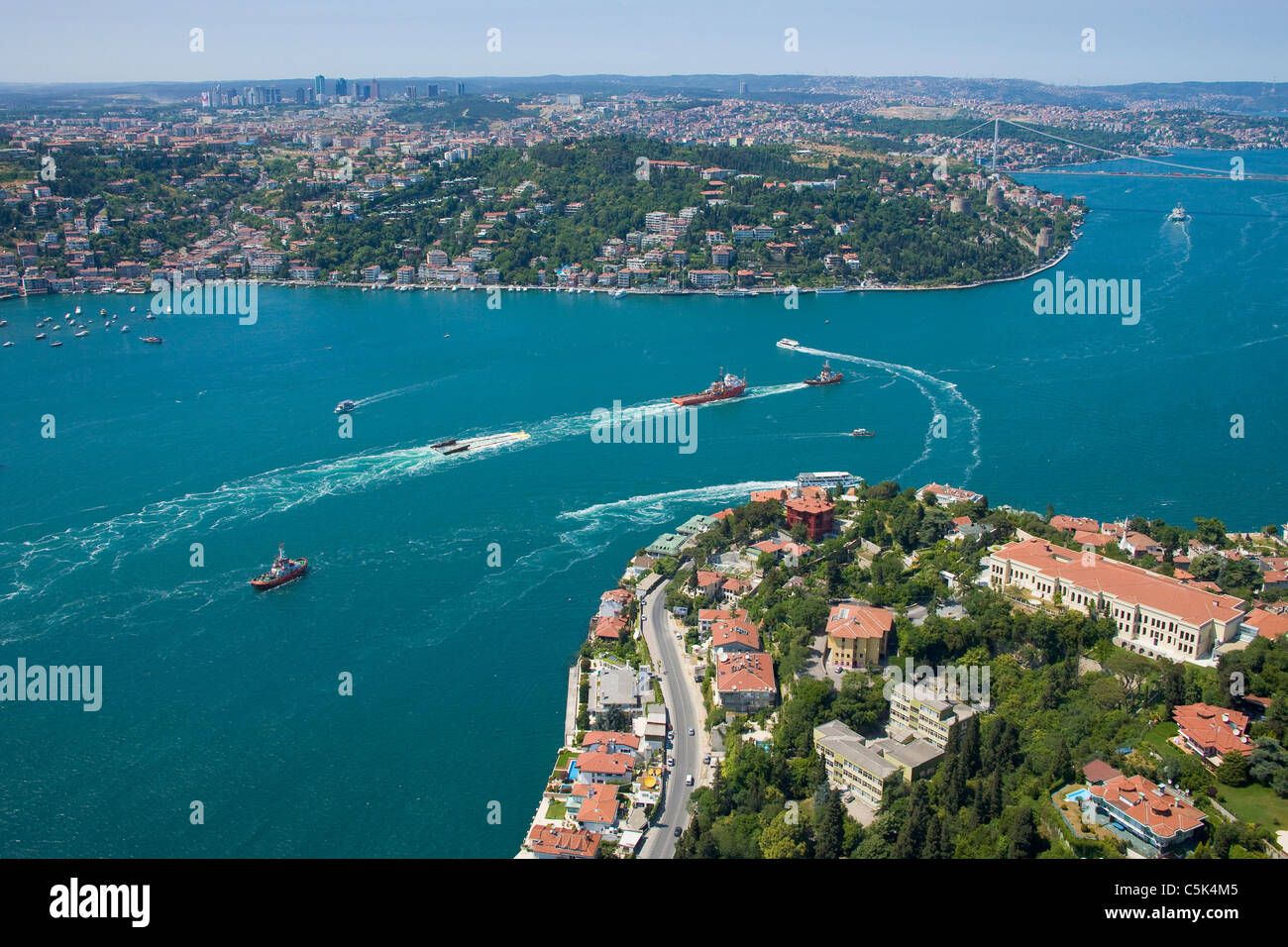 Boats towing a module of a natural gas platform through the Bosphorus, aerial, Istanbul - 2010 European Capital of Culture - Stock Photo