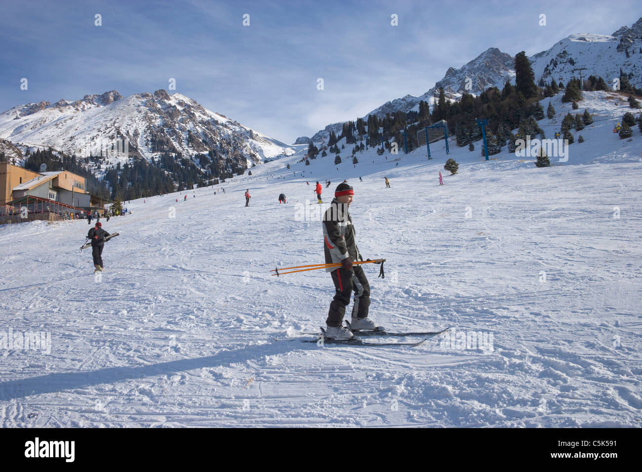 Skiers and snowboarders, snowy ski resort of Chimbulak, Kazakhstan Stock Photo