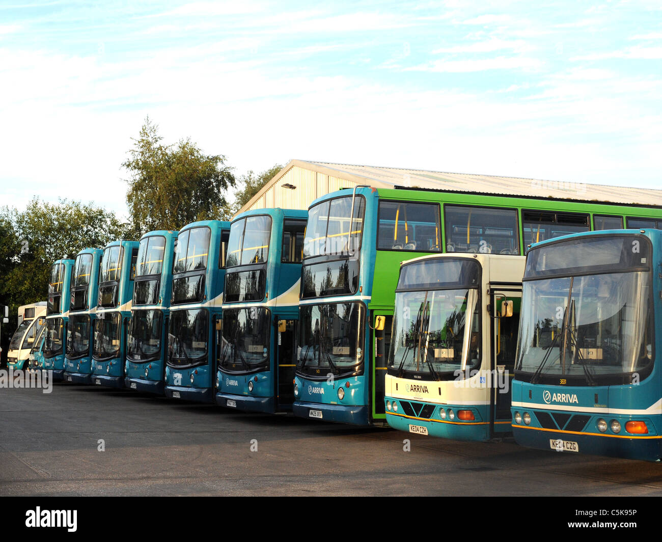 A line of Arriva buses at an Arriva bus garage. Stock Photo