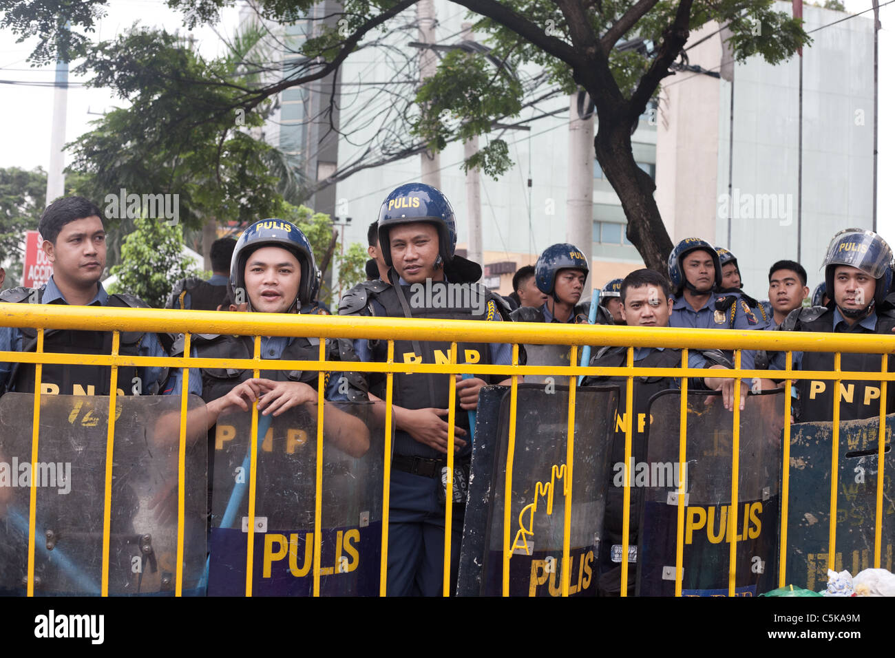 Riot police during protests on the occasion of the state of the nation address in Quezon City, Philippines. Stock Photo