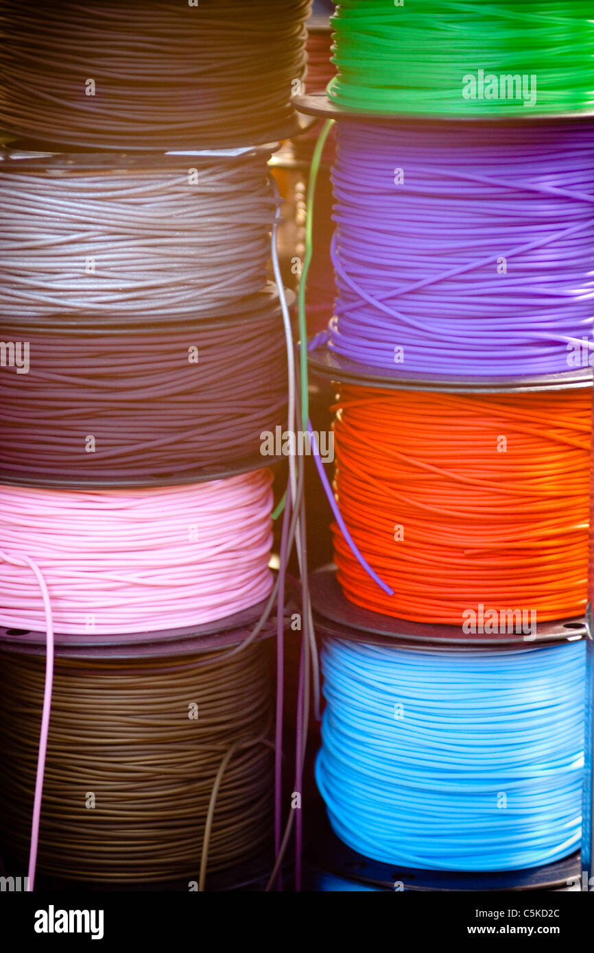 Rolls of cotton thread in many colors Stock Photo - Alamy