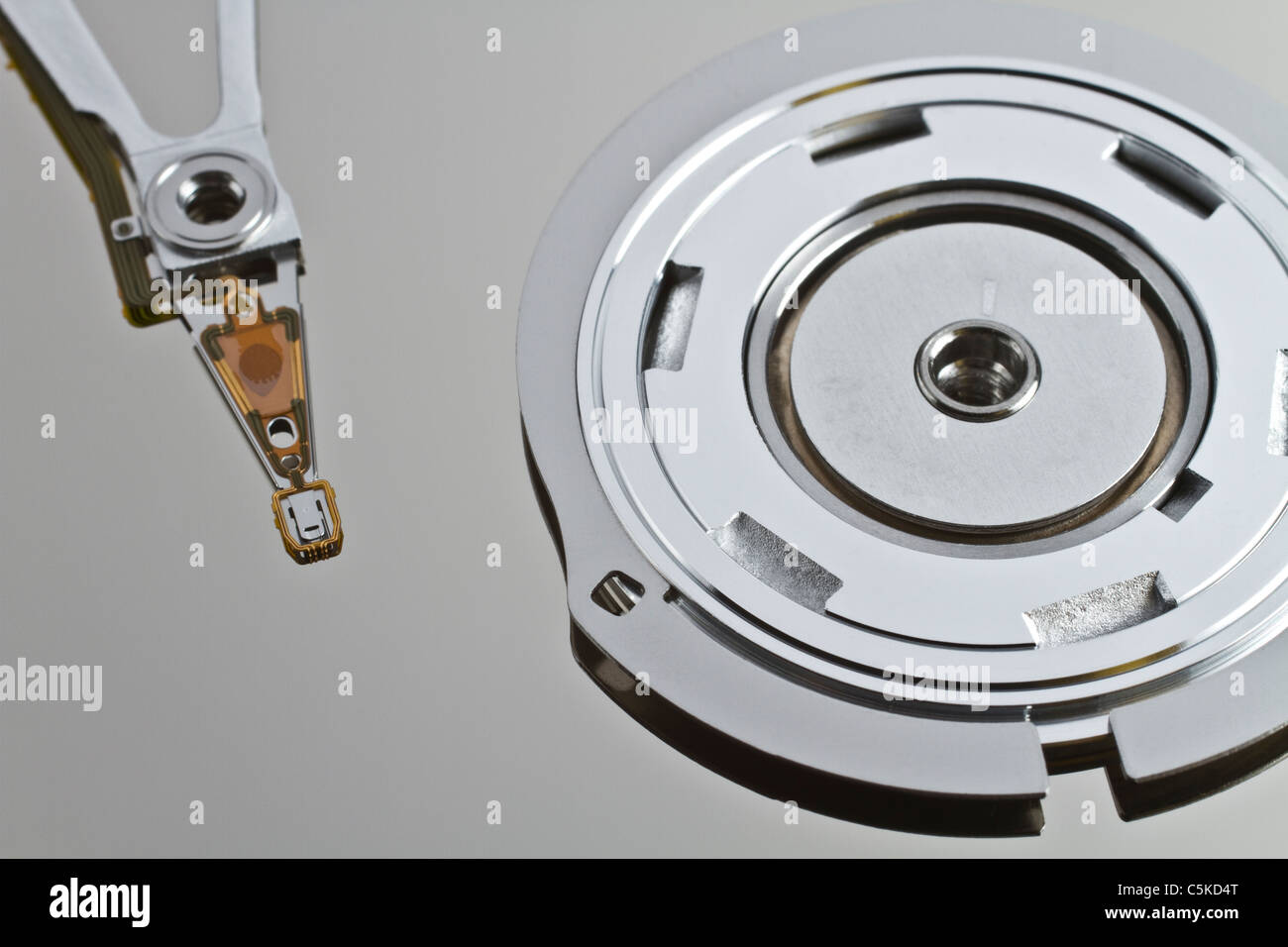 read write head in hard disk drive with platterand spindle in close up shot Stock Photo