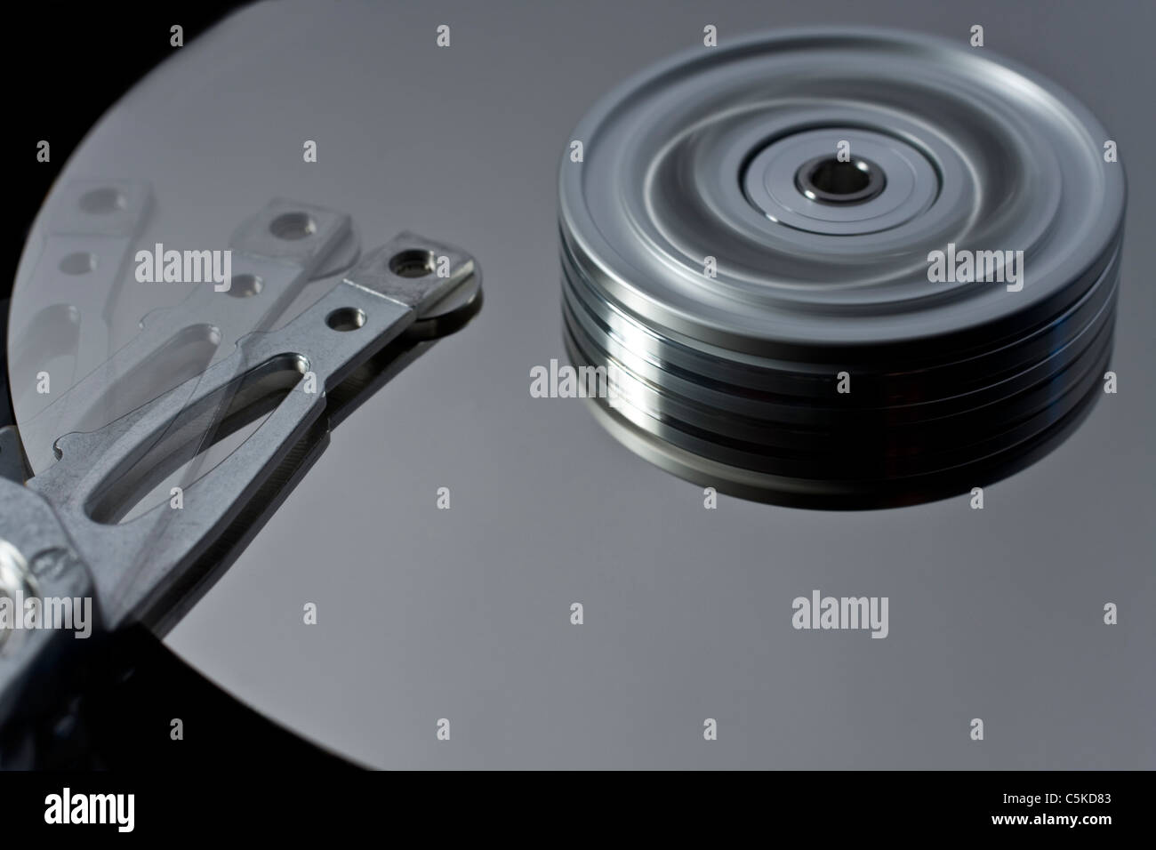 hard disk drive with read write head in motion Stock Photo
