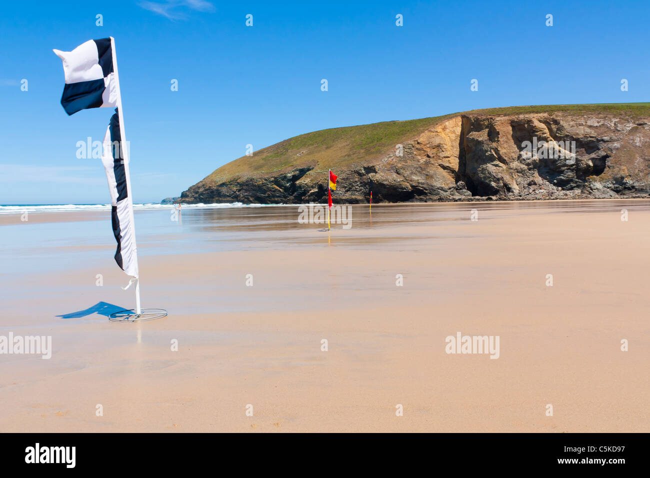 Lifeguard flags on the beach at Mawgan Porth near Newquay Cornwall England Stock Photo