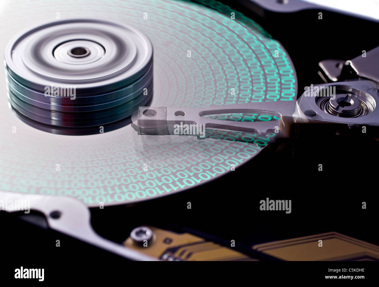 hard disk drive in close up with data on disk. head in motion Stock Photo