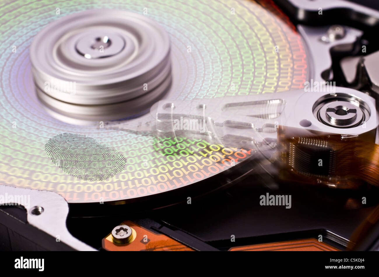Rotating Disk Key rotating hard disk drive with fingerprint and symbols for data Stock ...
