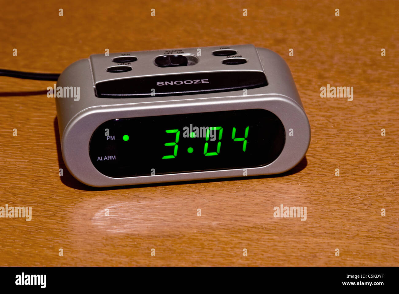 Digital alarm clock on nightstand Stock Photo Alamy