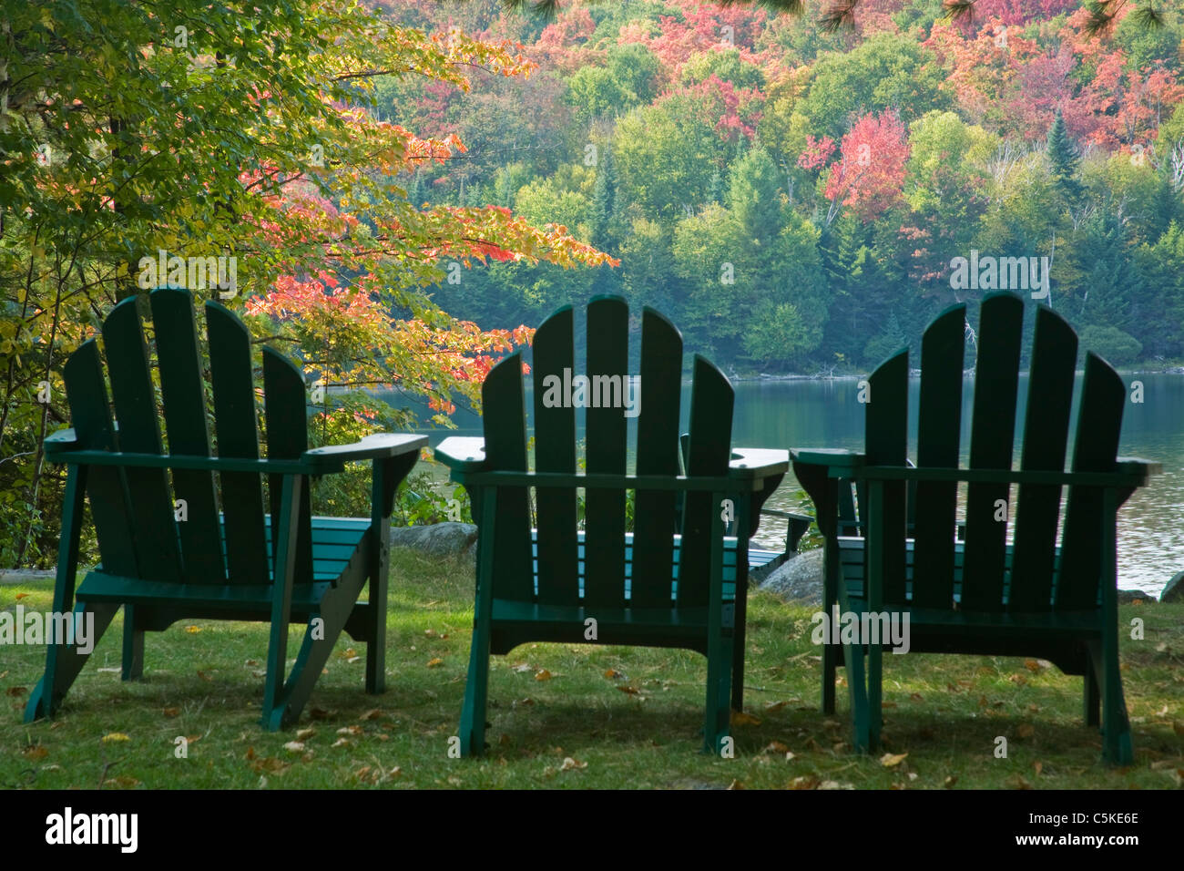 Adirondack chairs next to Heart Lake in Lake Placid. Stock Photo