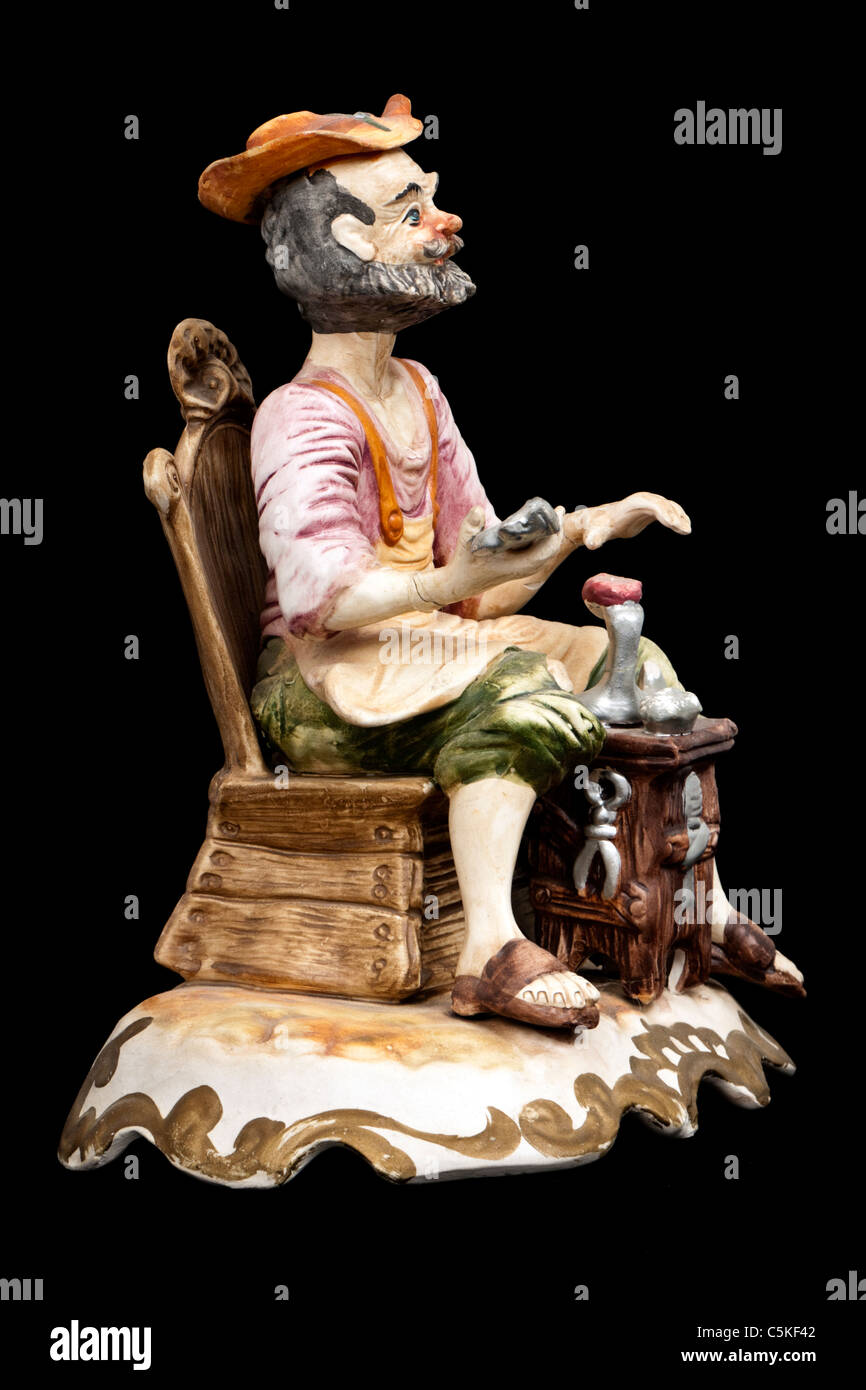 Italian Capodimonte cobbler figurine Stock Photo