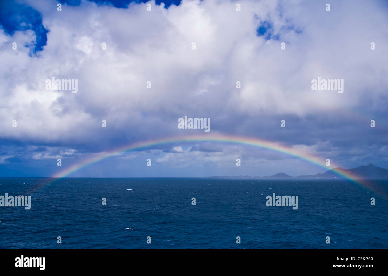 A nice rainbow seen coming into port of call at Saint Maarten Island. French and Dutch share this island. Stock Photo