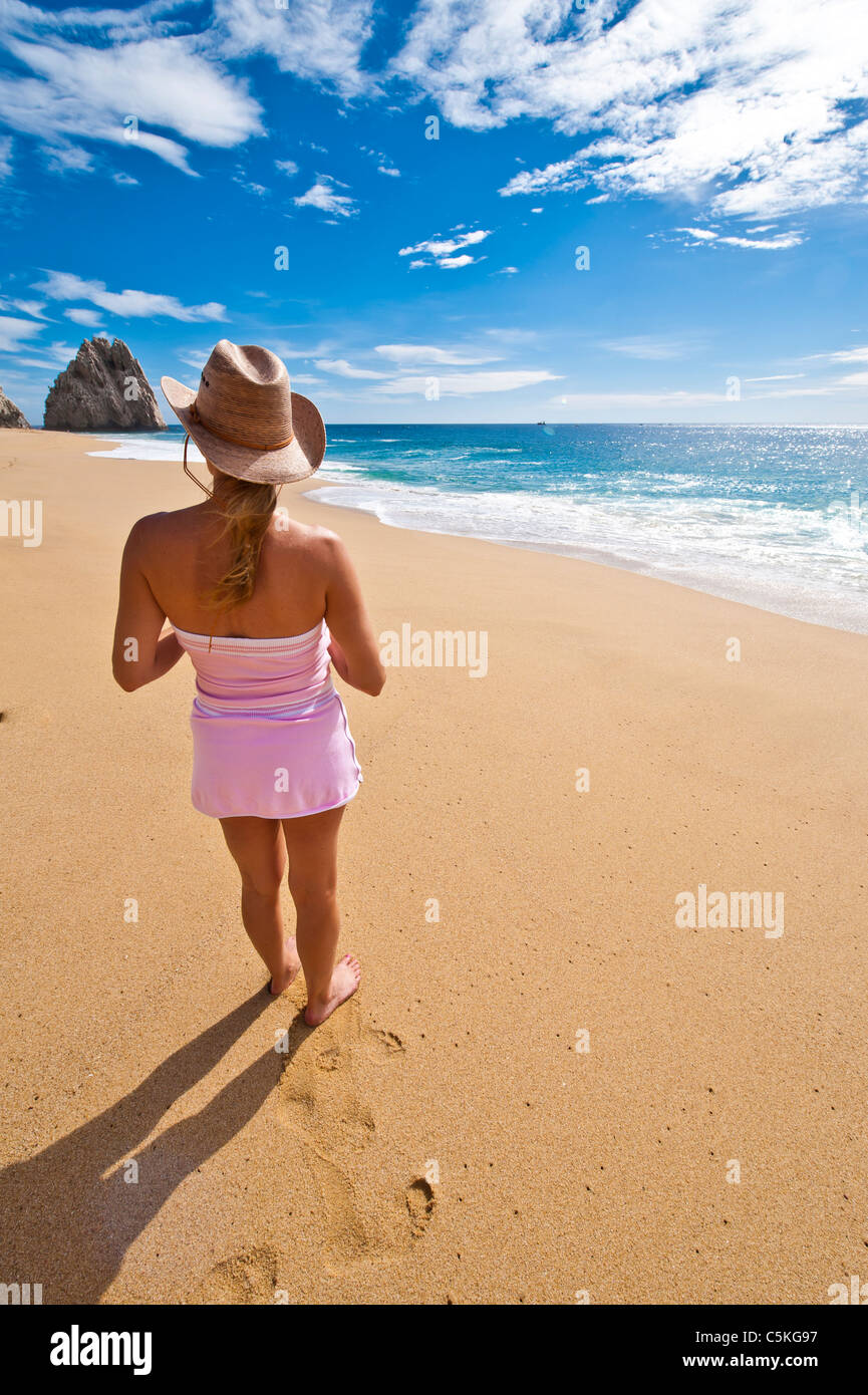 Beautiful woman enjoying the beach at Land's End at Cabo San Lucas, Mexico. Stock Photo
