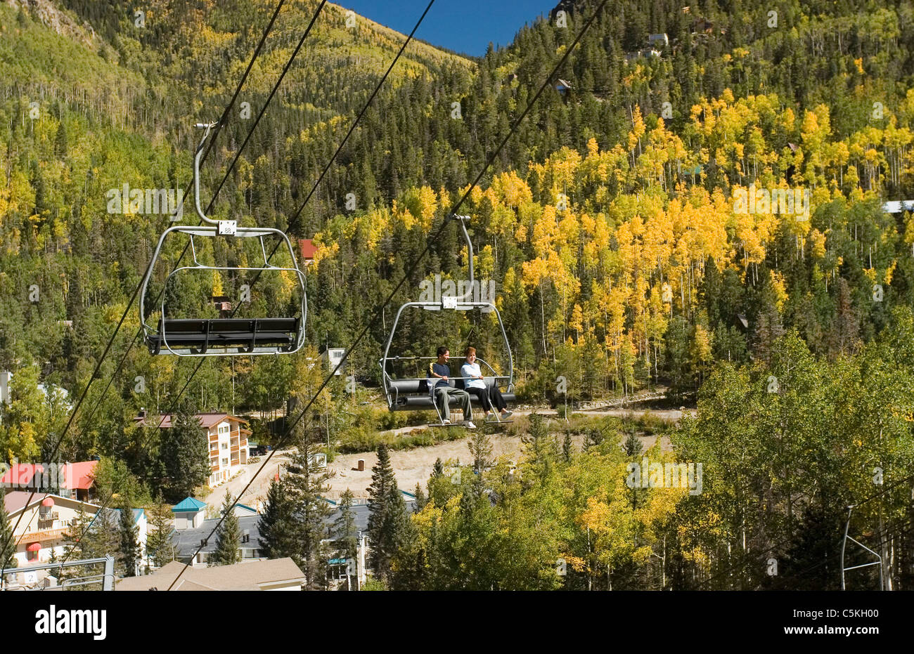 Close-up of people on chairlift at Taos Ski Valley, autumn Stock Photo