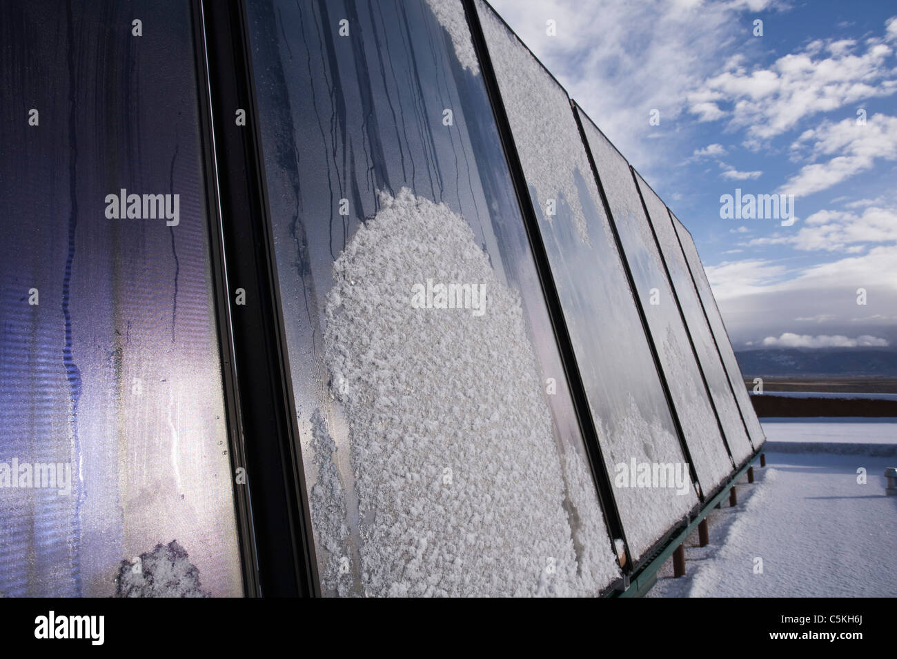 Solar panels installed on top of residence for thermal heating. Stock Photo