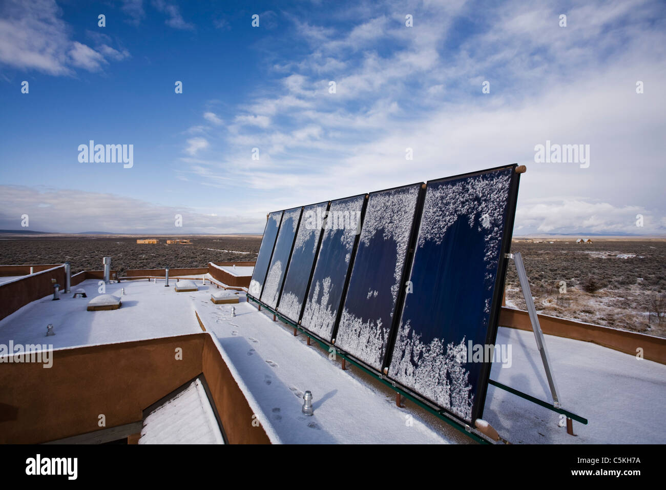Solar panels installed on top of residence for thermal heating. Stock Photo