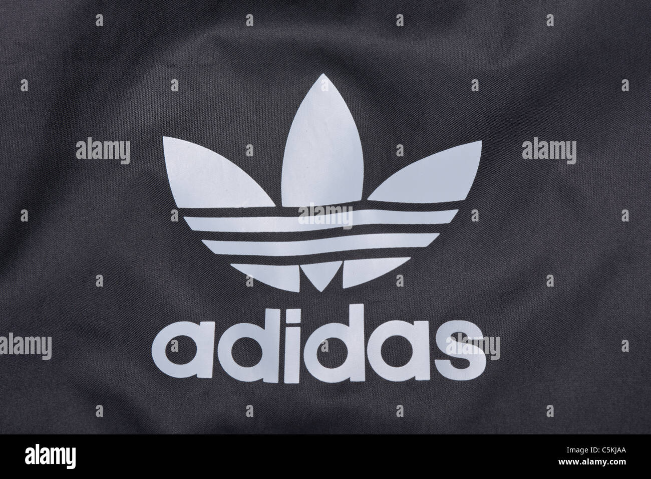 Adidas sportswear men's windbreaker jacket full zip hooded in nylon. With trefoil logo. Stock Photo