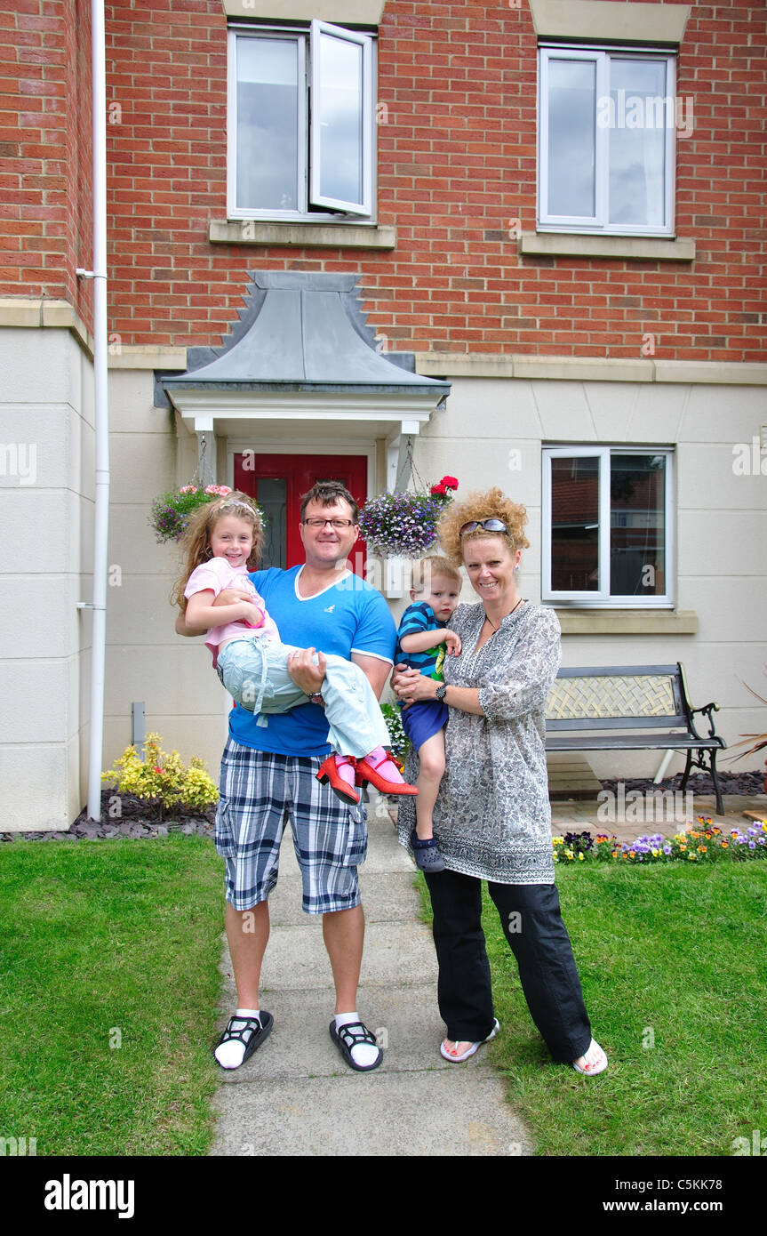 Family outside home, Gosport, Hampshire, England, United Kingdom Stock