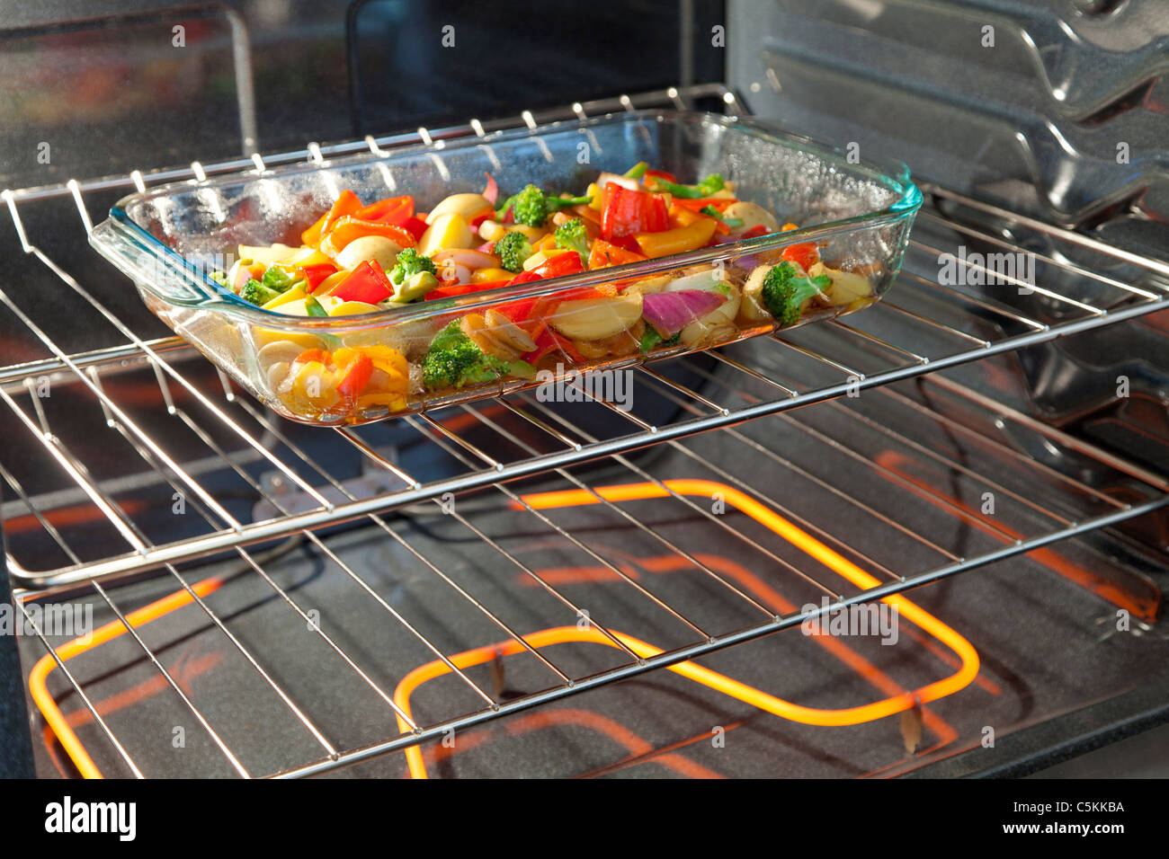 Fresh vegetables roasting in the oven Stock Photo