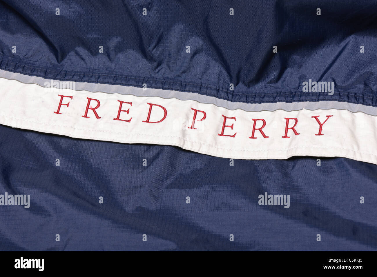 Fred Perry sportswear men's overhead nylon rain jacket cagoule. Logo detail  Stock Photo - Alamy