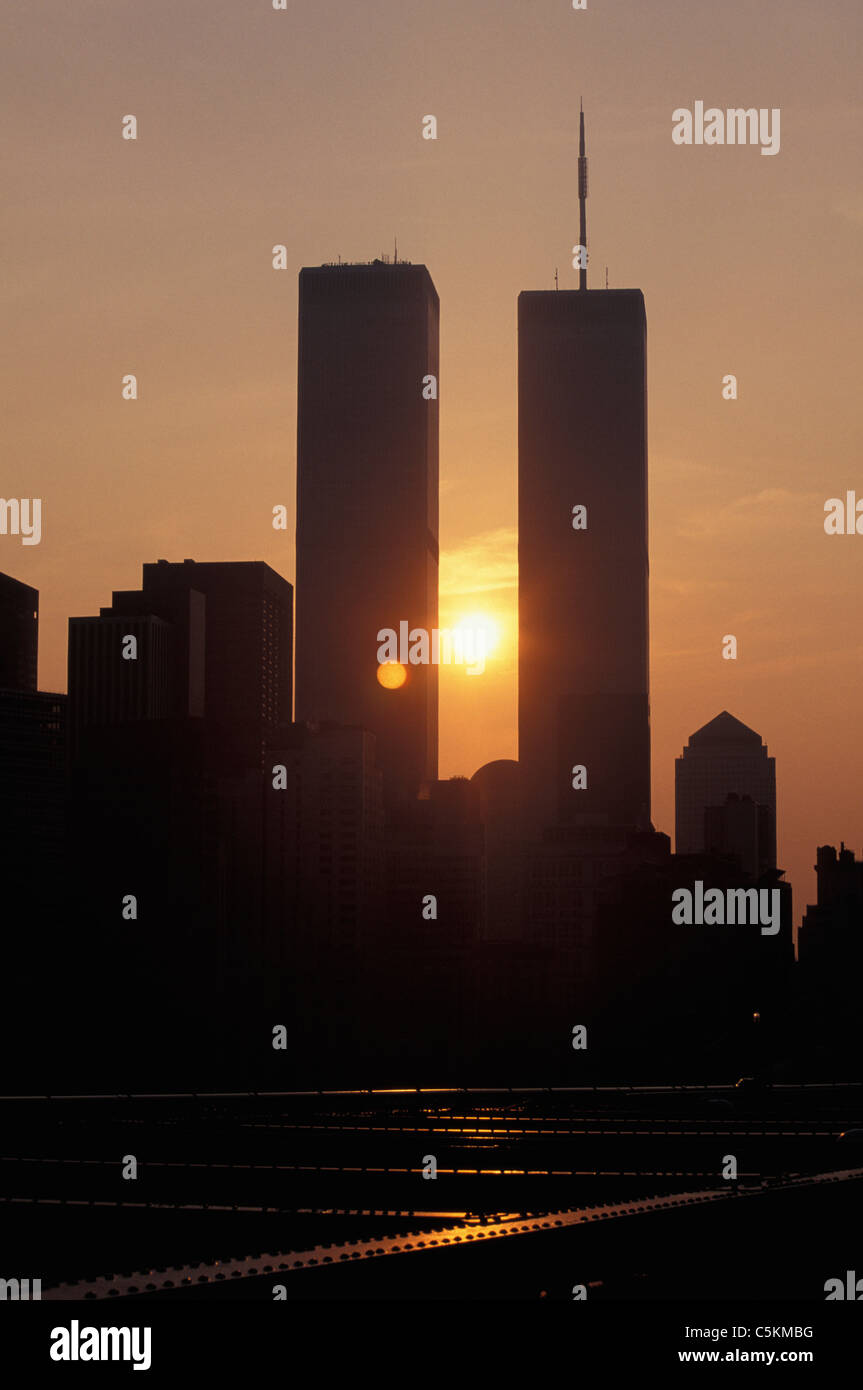 World Trade towers frm the base of the brooklyn bridge, with sun setting behind, NYC Stock Photo