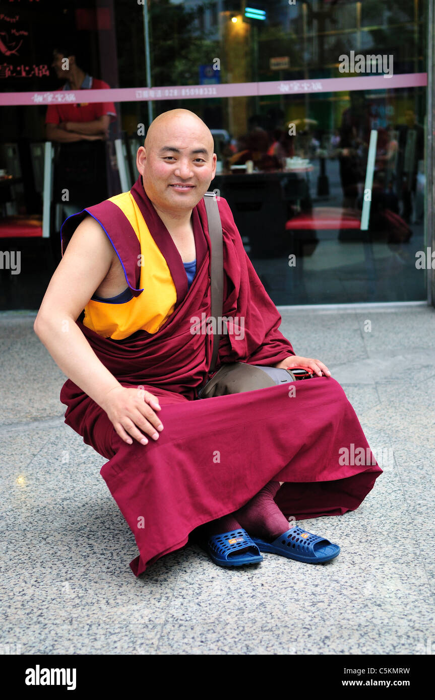 A Buddhism lama in red garment. Chegdu, Sichuan, China. Stock Photo