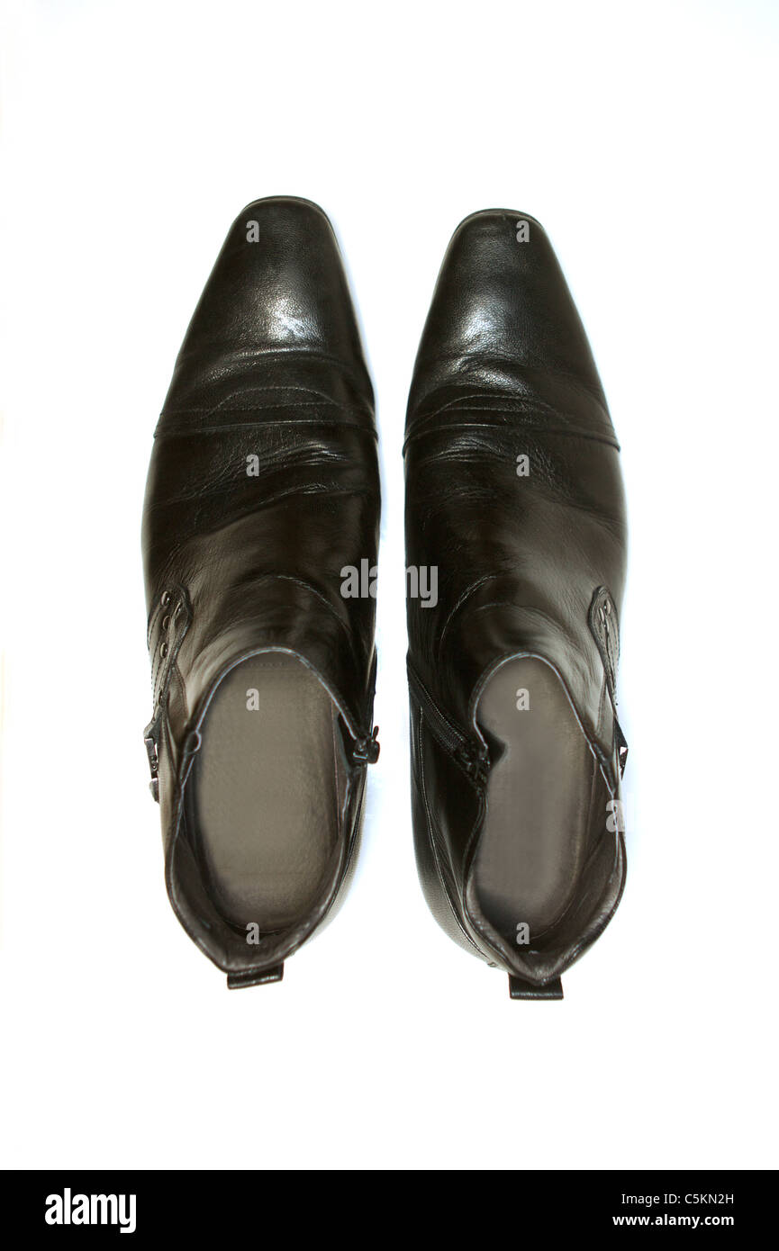 Leather boots isolated against a white background Stock Photo - Alamy