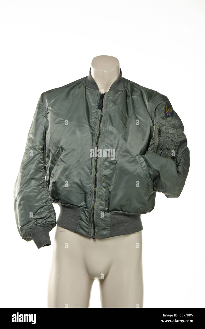 Men's U.S Airforce flight bomber jacket in sage green, reversible with safety orange on reverse. Stock Photo