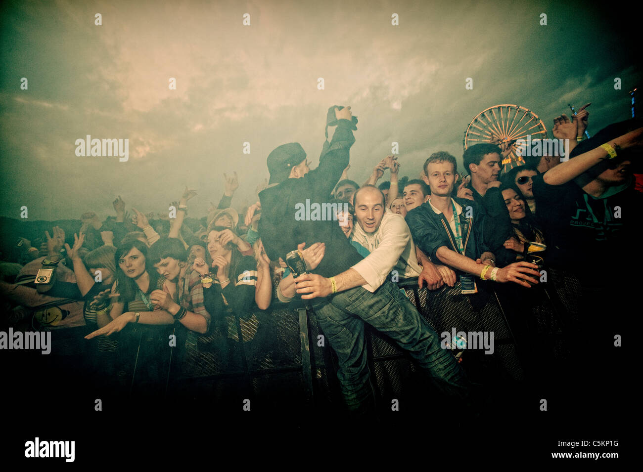 Photographer in the pit during large music festival Stock Photo Alamy